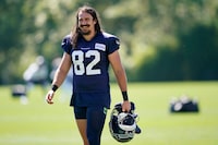 Seattle Seahawks tight end Luke Willson carries his helmet after NFL football training camp, Friday, Aug. 14, 2020, in Renton, Wash. The 34-year-old LaSalle, Ont., native held the Lombardi Trophy in 2014 as a rookie tight end after Seattle's 43-8 win over the Denver Broncos. But that euphoria turned to despair the following year when the New England Patriots rallied to beat the Seahawks 28-24. THE CANADIAN PRESS/AP-Ted S. Warren