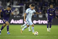 CF Montreal is used to embarking on long road trips early in the season. However, the beginning to the 2024 campaign is the most skewed since the team’s arrival in Major League Soccer. CF Montreal forward Matias Coccaro, centre, controls the ball in front of Orlando City midfielder Cesar Araujo, left, during an MLS soccer match, in Orlando, Fla., Saturday, Feb. 24, 2024. THE CANADIAN PRESS/AP-Phelan M. Ebenhack
