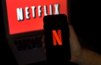 In this photo illustration a computer screen and mobile phone display the Netflix logo on March 31, 2020 in Arlington, Virginia. - According to Netflix chief content officer Ted Sarandos, Netflix viewership is on the rise during the coronavirus outbreak. (Photo by Olivier DOULIERY / AFP) (Photo by OLIVIER DOULIERY/AFP via Getty Images)