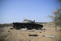 FILE PHOTO: Ammunition is seen next to a tank destroyed in a fight between the Ethiopian National Defence Force (ENDF) and the Tigray People's Liberation Front (TPLF) forces in Kasagita town, Afar region, Ethiopia, February 25, 2022. Picture taken February 25, 2022.REUTERS/Tiksa Negeri/File Photo