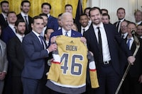 President Joe Biden holds a jersey during an event to celebrate the Vegas Golden Knights in their 2023 Stanley Cup victory in the East Room of the White House, Monday, Nov. 13, 2023, in Washington. (AP Photo/Andrew Harnik)