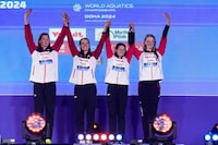 Team Canada stand on the podium after winning the bronze medal in the Women's 4x100m Medley Relay final at the World Aquatics Championships in Doha, Qatar, Sunday, Feb. 18, 2024. (AP Photo/Hassan Ammar)