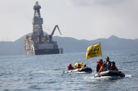 Greenpeace activists hold banners during a protest against the deep sea mining vessel Hidden Gem, commissioned by Canadian miner The Metals Company, in the Mexican Pacific port of Manzanillo, in Manzanillo, Mexico September 27, 2023. Gustavo Graf/Greenpeace Mexico/Handout via REUTERS THIS IMAGE HAS BEEN SUPPLIED BY A THIRD PARTY.