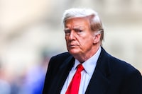 (FILES) Former US President Donald Trump arrives at 40 Wall Street after his court hearing to determine the date of his trial for allegedly covering up hush money payments linked to extramarital affairs in New York City on March 25, 2024. Embattled former US president Donald Trump posted a $175 million bond in his New York civil fraud case April 1, 2024, avoiding payment of a $454 million penalty while his case winds through the appeals process. (Photo by Charly TRIBALLEAU / AFP) (Photo by CHARLY TRIBALLEAU/AFP via Getty Images)