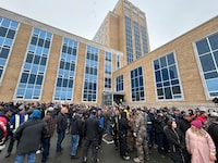 A large crowd of Newfoundland and Labrador fish harvesters gather in front of the legislature in St. John's on Thursday, March 21, 2024 after shutting down the provincial budget on Wednesday. THE CANADIAN PRESS/Sarah Smellie