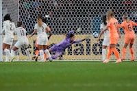 Portugal's Ines Pereira fails to save a goal by Netherlands' Stefanie Van der Gragt during the Women's World Cup Group E soccer match between the Netherlands and Portugal in Dunedin, New Zealand, Sunday, July 23, 2023. (AP Photo/Alessandra Tarantino)