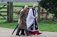 Britain's King Charles and Queen Camilla arrive for a church service, as Reverend Canon Dr Paul Williams reacts at St. Mary Magdalene's church on the Sandringham estate in eastern England, Britain, February 11, 2024. REUTERS/Chris Radburn