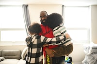 Ugo Ahana poses for a photograph with his 8 year-old son and 11 year-old daughter,  at his home in Brampton, Friday Feb. 16, 2024. (Christopher Katsarov/The Globe and Mail)