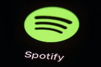 FILE- This March 20, 2018, file photo shows the Spotify app on an iPad in Baltimore. Spotify’s chief financial officer, Paul Vogel, is leaving next year, the music streaming service said, Friday, Dec. 8, 2023, — just days after the company announced its third round of layoffs for 2023. (AP Photo/Patrick Semansky, File)