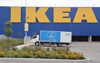 An electric delivery vehicle sits charging at an Ikea furniture store in Ottawa on Thursday, August 17, 2023. Experts say businesses in Canada are slowly entering a fleet transition journey to meet zero-emissions goals but it will not be an easy road. THE CANADIAN PRESS/ Patrick Doyle
