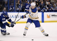 Buffalo Sabres defenseman Rasmus Dahlin (26) looks to shoot against Tampa Bay Lightning left wing Alex Killorn (17) during the first period of an NHL hockey game Thursday, Feb. 23, 2023, in Tampa, Fla. (AP Photo/Jason Behnken)