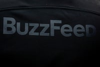 FILE PHOTO: A BuzzFeed sign is seen during the company's debut outside the Nasdaq Market in Times Square in New York City, U.S., December 6, 2021.  REUTERS/Brendan McDermid/File Photo