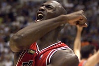 FILE PHOTO: Chicago Bulls Michael Jordan celebrates after the Bulls defeated the Utah Jazz 87-86 in game six of the NBA finals to win their 6th championship June 14, 1998 in Salt Lake City, Utah. Jordan, considered the greatest basketball player of all time, will announce his retirement this week, according to numerous print and broadcast reports. The New York Times, citing three NBA officials with knowledge of Jordan's plans, said the 35-year-old great would announce his decision to call it quits at a news conference in Chicago as early as Tu. Other reports said the official announcement would come January 13.    GMH/ZDC/HB/SV/File Photo