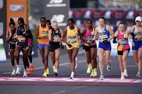 Runners including Joyce Chepkirui, Brigid Kosgei, Becky Briggs, Tigst Assefa and Mhairi Maclennan as the women's elite race gets under way at the London Marathon, London, Sunday April 21, 2024. (Zac Goodwin/PA via AP)