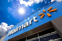 A Walmart sign is displayed over the entrance to a store, June 25, 2019, in Pittsburgh.