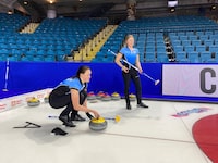 Kelly Middaugh, left, daughter of decorated Canadian curlers Wayne and Sherry Middaugh, is making her debut at the Canadian women's curling championship in Kamloops, B.C., playing lead for Quebec. She's part of the next generation of familiar Canadian curling names landing on the national stage. THE CANADIAN PRESS/Donna Spencer