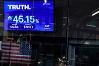 A screen displays trading information about shares of Truth. Social and Trump Media & Technology Group, outside the Nasdaq Market site in New York City, U.S., March 26, 2024. REUTERS/Brendan McDermid