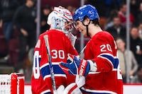 Sep 27, 2023; Montreal, Quebec, CAN; Montreal Canadiens left wing Juraj Slafkovsky (20) celebrates the win against the Ottawa Senators with goalie Cayden Primeau (30) after the end of the game at Bell Centre. Mandatory Credit: David Kirouac-USA TODAY Sports