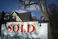 Mortgage experts expect the Bank of Canada's decision to hold the interest rate to add heat to the country's real estate markets. A real estate sold sign is shown in a Toronto west end neighbourhood May 16, 2020. THE CANADIAN PRESS/Graeme Roy
