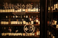 Wine bottles from around the world fill shelves in the cellar of Trio Wine Bar in Beijing, China November 1, 2023. REUTERS/Florence Lo/File Photo