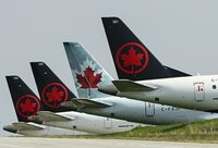 Air Canada says it is cancelling all direct flights to and from Tel Aviv through then end of the month. Air Canada planes sit on the tarmac at Pearson International Airport in Toronto on Wednesday, April 28, 2021. THE CANADIAN PRESS/Nathan Denette