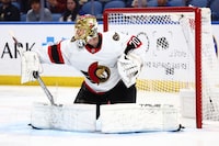 Ottawa Senators goaltender Joonas Korpisalo (70) makes a blocker save during the first period of an NHL hockey game against the Buffalo Sabres Wednesday, March 27, 2024, in Buffalo, N.Y. (AP Photo/Jeffrey T. Barnes)