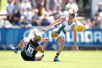 MELBOURNE, AUSTRALIA - FEBRUARY 10: Deni Varnhagen of the Crows is tackled by Sarah Hosking of the Blues during the 2019 NAB AFLW Round 02 match between the Carlton Blues and the Adelaide Crows at Ikon Park on February 10, 2019 in Melbourne, Australia. (Photo by Adam Trafford/AFL Media/Getty Images)