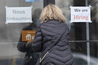 A customer enters a restaurant with help wanted signs Wednesday, November 17, 2021 in Laval, Que. Statistics Canada says the number of job vacancies at the beginning of April hit just over one million, up more than 40 per cent compared with a year earlier. THE CANADIAN PRESS/Ryan Remiorz