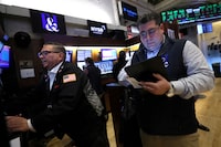 Traders work on the floor at the New York Stock Exchange (NYSE) in New York City, U.S., March 20, 2024.