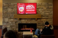 Signage for Tim Hortons' Roll Up the Rim contest is seen inside a Tim Hortons restaurant in Toronto, Friday, March 6, 2020. Tim Hortons says there's no merit to a proposed class action lawsuit regarding emails it sent out in error to Roll Up the Rim participants. THE CANADIAN PRESS/Cole Burston