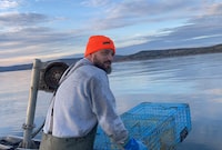 Indigenous fisherman Cody Caplin is shown on a boat in Chaleur Bay, N.B., in an Oct.13, 2023 handout photo. A judge in northern New Brunswick has granted a stay of proceedings in the trial of the Indigenous lobster fisherman who recently launched a constitutional challenge aimed at asserting his Indigenous and treaty rights to fish whenever he wants.THE CANADIAN PRESS/HO-Tom Keefer **MANDATORY CREDIT**
