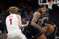 Orlando Magic forward Paolo Banchero (5) is defended by Toronto Raptors guard Gradey Dick (1) during the first half of an NBA basketball game, Sunday, March 17, 2024, in Orlando, Fla. (AP Photo/Phelan M. Ebenhack)