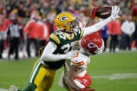 Green Bay Packers cornerback Carrington Valentine (37) breaks up a pass intended for Kansas City Chiefs wide receiver Marquez Valdes-Scantling (11) during the second half of an NFL football game Sunday, Dec. 3, 2023 in Green Bay, Wis. (AP Photo/Mike Roemer)