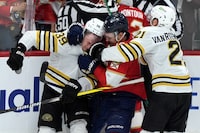 Florida Panthers center Sam Reinhart (13), Boston Bruins center Morgan Geekie, center, and Florida Panthers center Aleksander Barkov (16) get into a scuffle during the third period of Game 2 of a second-round series of the NHL hockey Stanley Cup playoffs Wednesday, May 8, 2024, in Sunrise, Fla. (AP Photo/Lynne Sladky)
