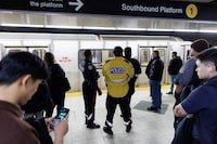 <div>Toronto mayor Olivia Chow is backing a transit safety plan to hire 178 new frontline staff, mostly by adding more customer service agents at transit stations. Police officers are seen on the platform as people wait for a subway train inside a TTC station in Toronto, Saturday, April 1, 2023. THE CANADIAN PRESS/Cole Burston</div>