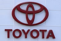 FILE - The Toyota logo is shown on a dealership in Manchester, N.H., in this Thursday, Aug. 15, 2019, file photo. Toyota will invest an additional $8 billion in the hybrid and electric vehicle battery factory it's constructing in central North Carolina, more than doubling its prior investments and expected number of new jobs, the company announced Tuesday, Oct. 31, 2023. (AP Photo/Charles Krupa, File)