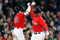 Boston Red Sox's Rafael Devers, right, celebrates after his two-run home run with Jarren Duran (16) during the eighth inning of a baseball game against the Toronto Blue Jays, Thursday, May 4, 2023, in Boston. (AP Photo/Michael Dwyer)