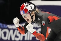 Canada's Kim Boutin celebrates winning the gold medal in the women's 500 meters final during the World Championships Short Track skating at Ahoy Arena in Rotterdam, Netherlands, Saturday, March 16, 2024. (AP Photo/Peter Dejong)