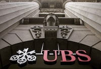 FILE PHOTO: The logo of Swiss bank UBS is seen at the company's office at the Bahnhofstrasse in Zurich in this July 1, 2009 file photo.   REUTERS/Arnd Wiegmann/File Photo
