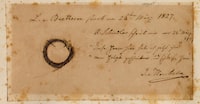 This undated image released by the Beethoven Studies, San Jose State University, shows the Moscheles Lock of German composer Ludwig van Beethoven, authenticated by the study, with inscription by former owner Ignaz Moscheles. - Beethoven died in Vienna nearly 200 years ago after a lifetime of composing some of the most influential works in classical music. Ever since, biographers have sought to explain the causes of the German composer's death at the age of 56, his progressive hearing loss and his well-documented struggles with chronic illness. A team of researchers who sequenced Beethoven's genome using locks of the German composer's hair may now have some answers. Liver failure, or cirrhosis, was the possible cause of Beethoven's death brought about by a number of factors, including the composer's alcohol consumption, they said. (Photo by Ira F. Brilliant / Center for Beethoven Studies, San Jose State University / AFP) / RESTRICTED TO EDITORIAL USE - MANDATORY CREDIT "AFP PHOTO / Ira F. Brilliant / Center for Beethoven Studies, San Jose State University" - NO MARKETING NO ADVERTISING CAMPAIGNS - DISTRIBUTED AS A SERVICE TO CLIENTS (Photo by IRA F. BRILLIANT/Center for Beethoven Studies, Sa/AFP via Getty Images)