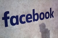FILE - This photo shows a Facebook logo being displayed in a start-up companies gathering at Paris' Station F, in Paris on Jan. 17, 2017. Nearly 200 former content moderators for Facebook are suing the company and a local contractor in a court case in Kenya that could have implications for the work worldwide. (AP Photo/Thibault Camus, File)