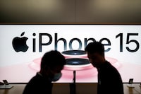 FILE PHOTO: An Apple iPhone 15 advertisement is seen as it officially goes on sale across China at an Apple Store in Shanghai, China September 22, 2023. REUTERS/Aly Song/File Photo