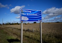 An Ontario Greenbelt sign is shown by farmland near Caledon, Ont., on Thursday, October 12, 2023. Ontario's municipal affairs and housing minister is expected to introduce legislation today to return parcels of land to the protected Greenbelt. THE CANADIAN PRESS/Nathan Denette