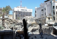 An excavator clears rubble after a suspected Israeli strike on Monday on Iran's consulate, adjacent to the main Iranian embassy building, which Iran said had killed seven military personnel including two key figures in the Quds Force, in the Syrian capital Damascus, Syria April 2, 2024. REUTERS/Firas Makdesi
