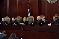 FILE - Arizona Supreme Court Justices from left; William G. Montgomery, John R Lopez IV, Vice Chief Justice Ann A. Scott Timmer, Chief Justice Robert M. Brutinel, Clint Bolick and James Beene listen to oral arguments on April 20, 2021, in Phoenix. The Arizona Supreme Court ruled Tuesday., April 9, 2024, that the state can enforce its long-dormant law criminalizing all abortions except when a mother’s life is at stake.   (AP Photo/Matt York, File)