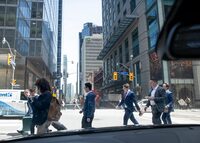 Pedestrians walking north on Bay St. while crossing Adelaide St. West, are photographed on May 6, 2024. (Fred Lum/The Globe and Mail)
