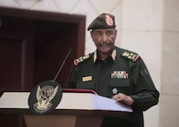 FILE - Sudan's Army chief Gen. Abdel-Fattah Burhan speaks in Khartoum, Sudan, on Dec. 5, 2022. Sudan’s warring generals Gen. Abdel-Fattah Burhan and Gen. Mohammed Hamdan Dagalo, agreed to hold a face-to-face meeting as part of efforts to establish a cease-fire and initiate political talks to end the country’s devastating war, an African regional bloc said Sunday, Dec 10, 2023. (AP Photo/Marwan Ali, File)