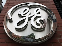 FILE PHOTO: The General Electric Co. logo is seen on the company's corporate headquarters building in Boston, Massachusetts, U.S. July 23, 2019. REUTERS/Alwyn Scott