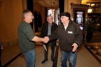Left to right is Richard Beauvais and Eddy Ambrose meeting in person for the first time, as their lawyer Bill Gange looks on, at the Fort Garry Hotel in Winnipeg on March 19, 2024. Shannon VanRaes/The Globe and Mail