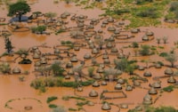 FILE PHOTO: An aerial view shows a deserted and flooded traditional homestead following heavy rains in Garsen, Tana Delta within Tana River county, Kenya November 23, 2023. REUTERS/Thomas Mukoya/File Photo